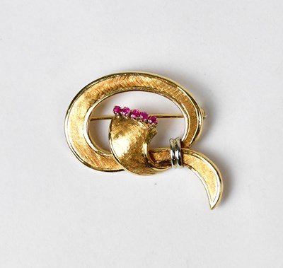 Lot 874 - An 18ct gold brooch in the form of a knot, set...