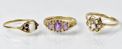 Lot 844 - Three 9ct gold rings comprising a cluster ring...