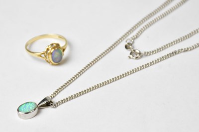 Lot 894 - A 9ct white gold pendant set with cabochon...
