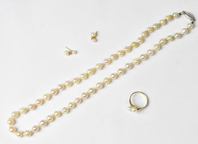 Lot 836 - A 9ct yellow gold ring set with two pearls in...