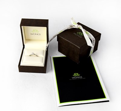 Lot 921 - A platinum diamond solitaire ring set with a...