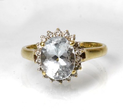 Lot 827 - A 9ct yellow gold cluster ring, set with a...