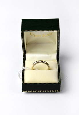 Lot 974 - A white gold ring set with three small...