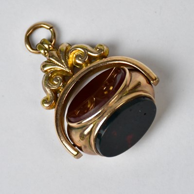 Lot 968 - A yellow metal watch fob in the form of a seal,...