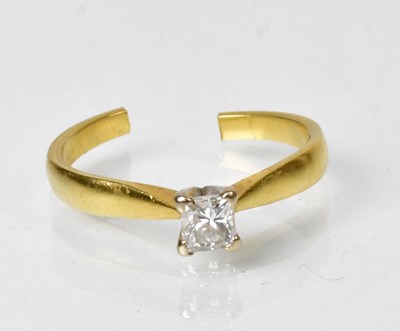 Lot 847 - A yellow metal ring set with solitaire diamond...