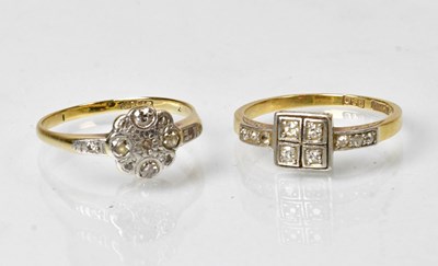 Lot 804 - An 18ct gold ring set with four small diamonds...