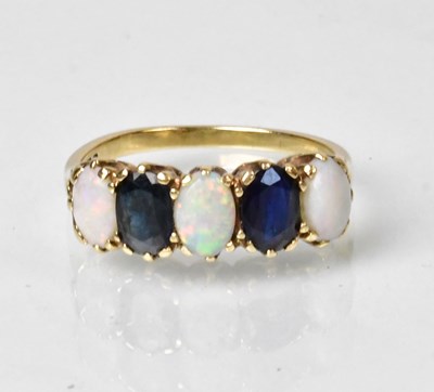 Lot 833 - A 9ct yellow gold ring, alternately set with...