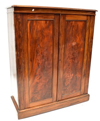 Lot 73 - A Victorian mahogany cupboard with panelled...