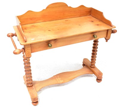 Lot 30 - A Victorian-style pine wash stand with...
