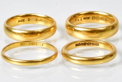 Lot 790 - Four 22ct gold wedding bands, various...