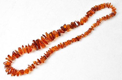 Lot 931 - A graduated set of Baltic amber rough cut beads.