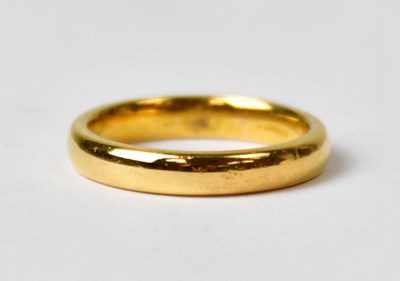 Lot 781 - A 22ct gold wedding band, size I, stamped '22',...