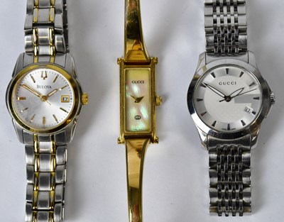 Lot 1065 - GUCCI; two ladies' stainless steel...