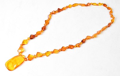 Lot 932 - A set of natural cut graduated Baltic amber...