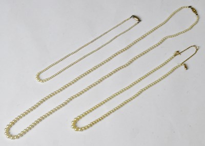 Lot 925 - Three simulated pearl necklaces, one stamped...