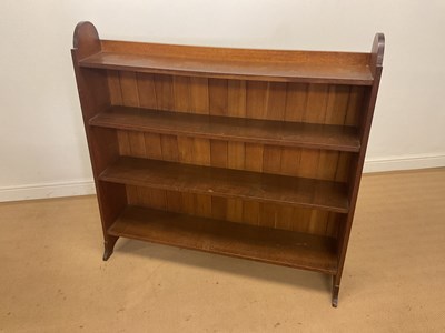Lot 251 - HEALS; an Arts and Crafts oak open bookcase...
