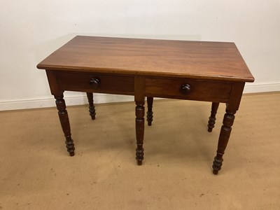 Lot 311 - A mahogany two drawer side table, with unusual...
