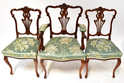 Lot 34 - A set of three mahogany carved splat back...