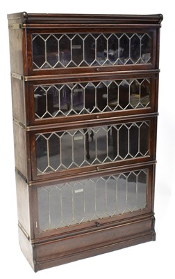 Lot 36 - GLOBE WERNICKE; an oak four-section graduated...