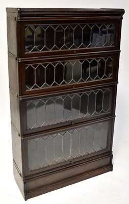 Lot 37 - GLOBE WERNICKE; an oak four-section graduated...