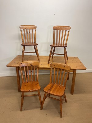 Lot 297 - A modern pine rectangular kitchen table,...