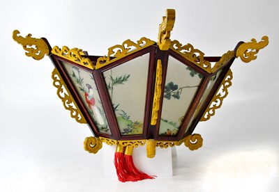 Lot 69 - An Oriental-style wooden framed lampshade,...