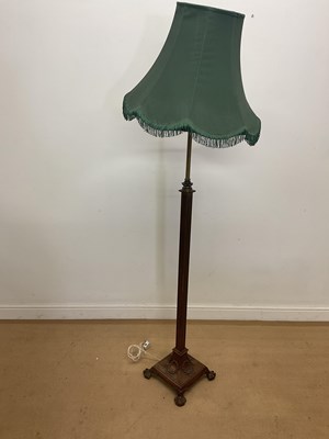 Lot 223 - A telescopic brass standard lamp, raised on...