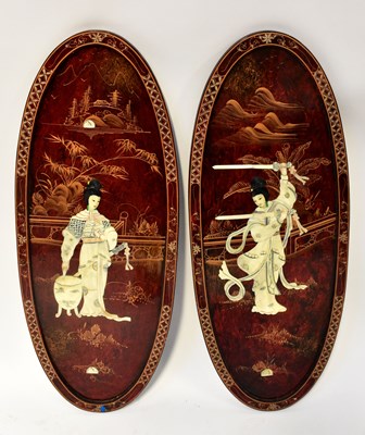 Lot 214 - A pair of oval red lacquered gilt-heightened...