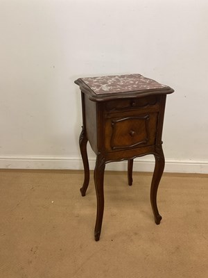 Lot 274 - A French walnut bedside table with marble...