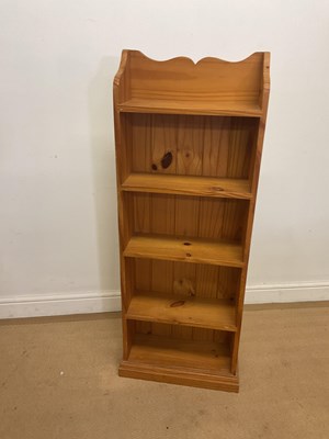 Lot 310 - A modern narrow pine open bookcase, width 45cm.