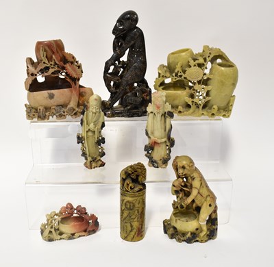 Lot 218 - A group of soapstone carvings comprising a...