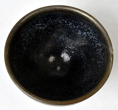 Lot 141 - A Chinese stoneware tea bowl with mottled...