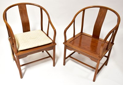 Lot 133 - A pair of Chinese elm horseshoe-backed chairs,...