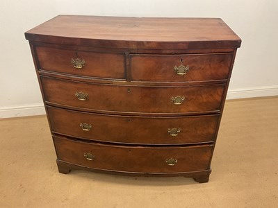 Lot 325 - An early 19th century mahogany bowfront chest...