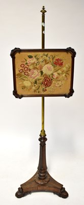 Lot 33 - A William IV rosewood and brass pole screen,...