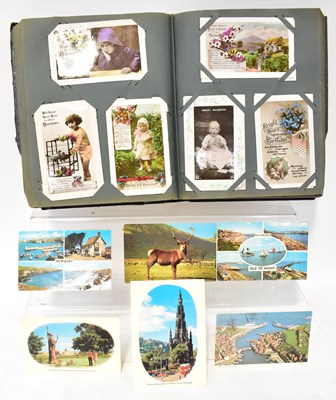 Lot 698 - A late 19th early 20th century postcard album...