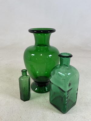 Lot 118 - A large green glass baluster vase, height 30cm,...