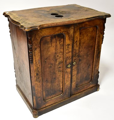 Lot 21 - A Victorian walnut cupboard with panelled...