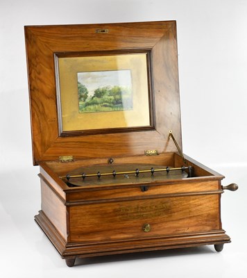 Lot 1391 - G E JACKSON; a walnut cased symphonium, height...