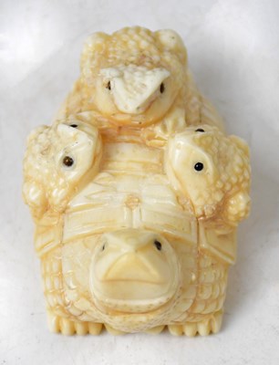 Lot 185 - A Japanese bone netsuke in the form of a...