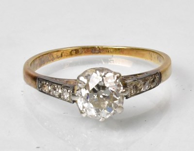 Lot 795 - An 18ct yellow gold ring set with a solitaire...
