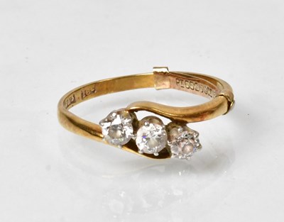 Lot 800 - An 18ct yellow gold ring with three diamonds...
