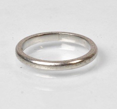 Lot 777 - A platinum wedding band, stamped platinum,...