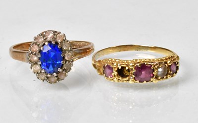 Lot 840 - A 19ct yellow gold cluster ring set with blue...