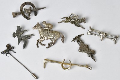 Lot 888 - Four silver brooches, comprising a bar brooch...