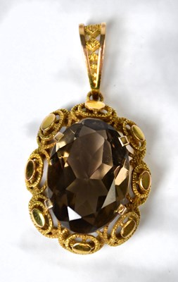 Lot 919 - A yellow metal pendant set with a smoky quartz...