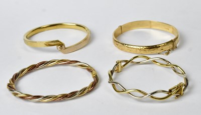 Lot 868 - Four 9ct gold bracelets and bangles,...