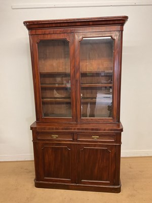 Lot 285 - A Victorian mahogany bookcase on cupboard,...