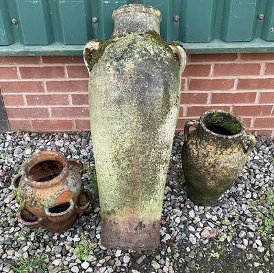 Lot 236 - A terracotta glazed twin handled amphora, a...