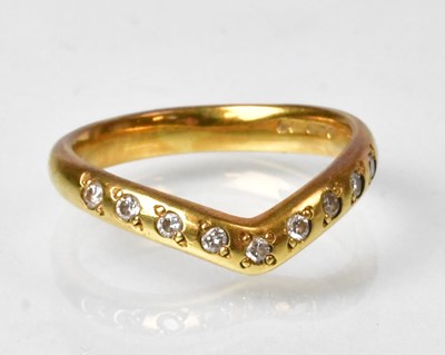 Lot 808 - An 18ct gold ring in the form of a chevron,...